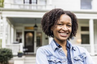 Single African American Woman In Front Of Suburban Home Gettyimages 1482429588 07 10 2024 1200w 628h.jpg