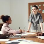 Woman Leading In Small Business Meeting