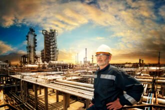 A Person Standing Next To An Energy Facility.jpg