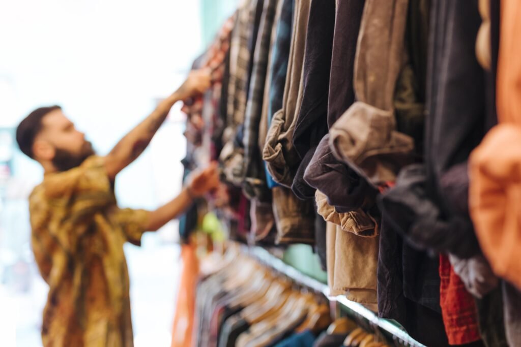 Defocussed Man Choosing Shirt Consumer Shopping Outlook