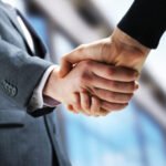 Depositphotos 10654338 Stock Photo Two Businessmen Shaking Hands 677x451 1.jpg