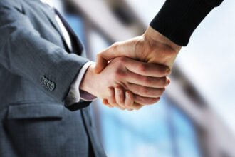 Depositphotos 10654338 Stock Photo Two Businessmen Shaking Hands 677x451 1.jpg