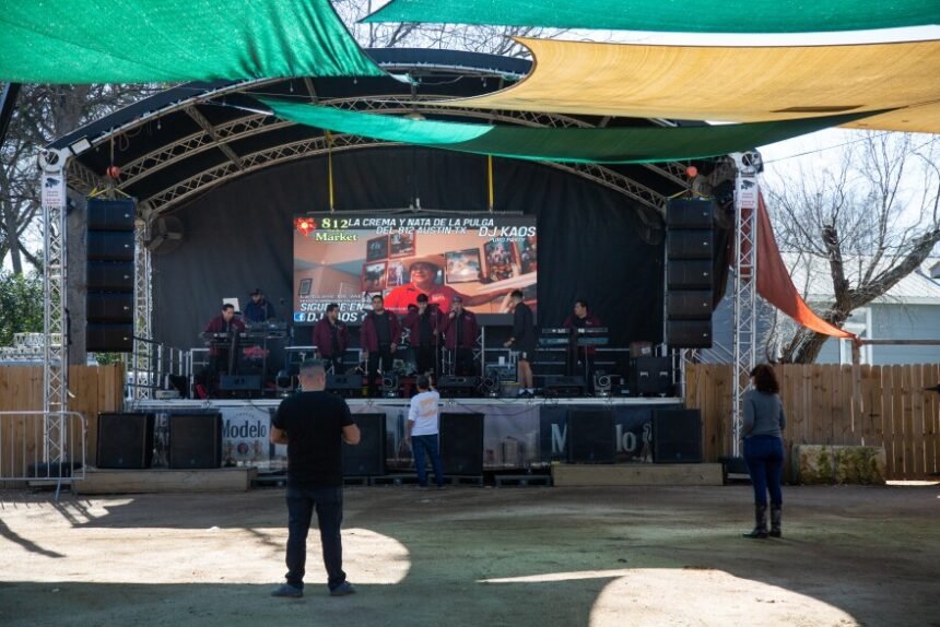 A handful of people listen to music from a band at the 812 Outdoor Market. Vendors say that on most weekends the floor would be full of dozens of couples dancing to the music, but fears of immigration