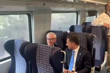 74624188007 Buttigieg Evers Amtrack Karnopp.jpg