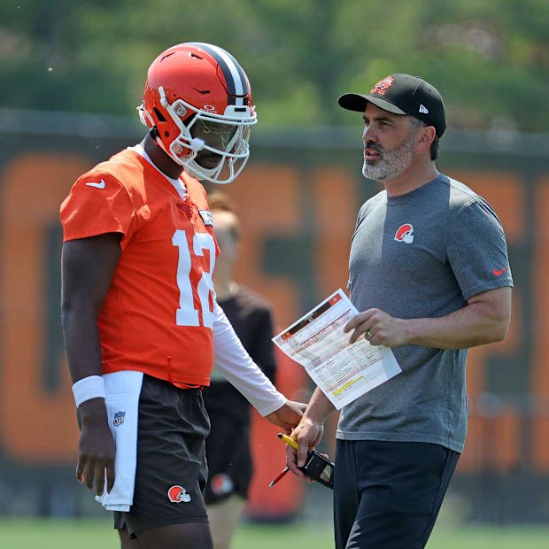 Cleveland Browns quarterback Shedeur Sanders (12) speaks with head coach Kevin Stefanski during practice at NFL minicamp, Wed