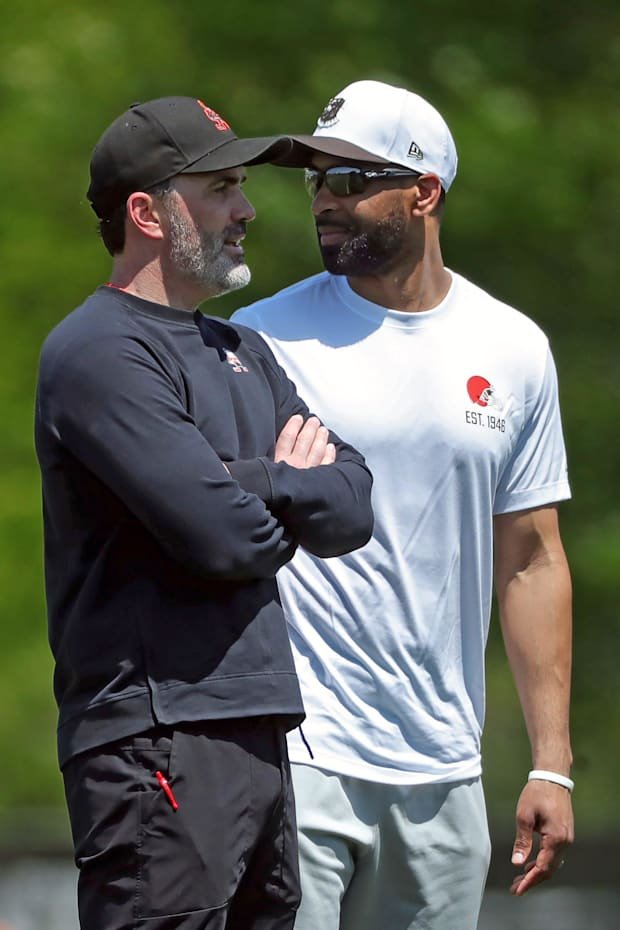 Cleveland Browns head coach Kevin Stefanski and general manager Andrew Berry watch practice from the sideline during day two 