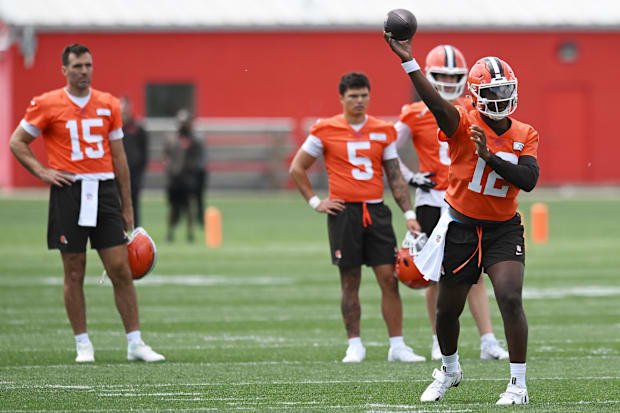 Jun 10, 2025; Berea, OH, USA; Cleveland Browns quarterback Shedeur Sanders (12) throws a pass as quarterback Joe Flacco (15) 