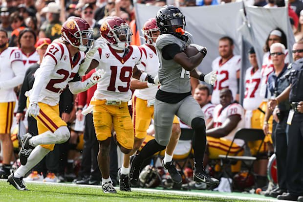 Sep 30, 2023; Boulder, Colorado, USA; Colorado Buffaloes wide receiver Omarion Miller (14) runs the ball past USC Trojans def