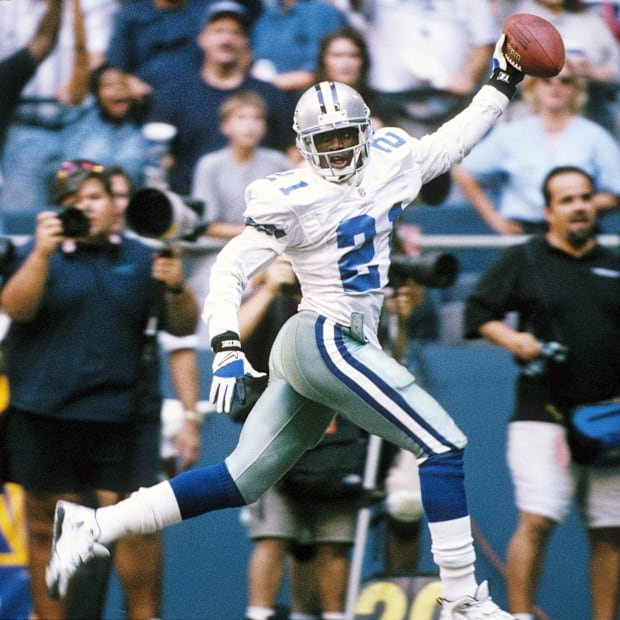 Sep 11, 1997; Irving, TX, USA; FILE PHOTO: Dallas Cowboys  defensive back  Deion Sanders (21) celebrating as he scores a touc