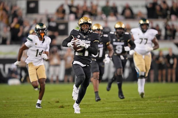 Sep 16, 2023; Boulder, Colorado, USA; Colorado Buffaloes safety Shilo Sanders (21) runs for a touchdown after making an inter