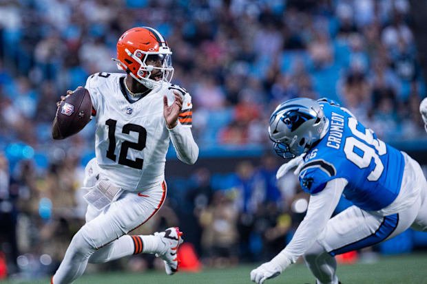Aug 8, 2025; Charlotte, North Carolina, USA; Cleveland Browns quarterback Shedeur Sanders (12) gets away from Carolina Panthe