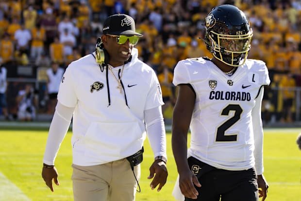Oct 7, 2023; Tempe, Arizona, USA; Colorado Buffaloes head coach Deion Sanders with son and quarterback Shedeur Sanders (2) ag