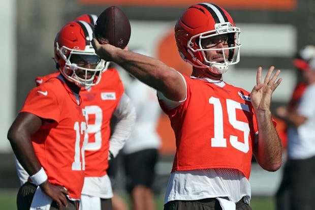 Cleveland Browns quarterback Joe Flacco (15) throws as quarterback Shedeur Sanders (12) looks on during a training camp pract