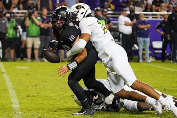 Oct 4, 2025; Fort Worth, Texas, USA; TCU Horned Frogs quarterback Josh Hoover (10) is strip sacked by Colorado Buffaloes defe