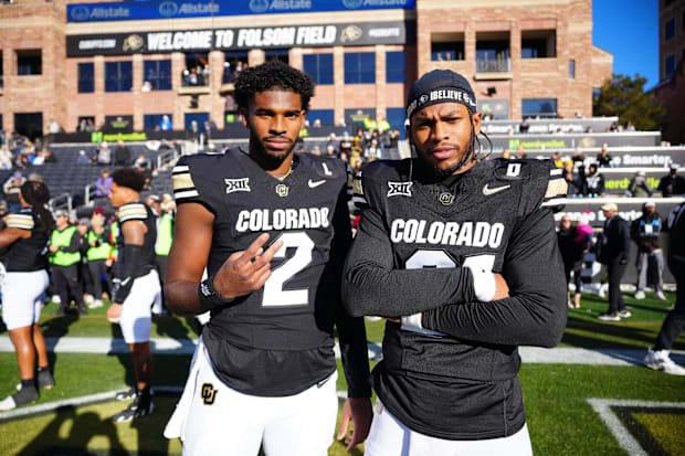 Nov 29, 2024; Boulder, Colorado, USA; Colorado Buffaloes quarterback Shedeur Sanders (2) and safety Shilo Sanders (21) pose f