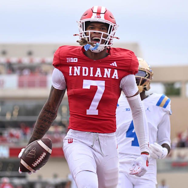 Oct 25, 2025; Bloomington, Indiana, USA; Indiana Hoosiers wide receiver E.J. Williams Jr. (7) reacts after scoring a touchdow