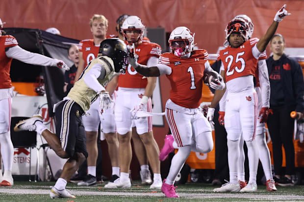 Oct 25, 2025; Salt Lake City, Utah, USA; Utah Utes running back Wayshawn Parker (1) runs against Colorado Buffaloes defensive