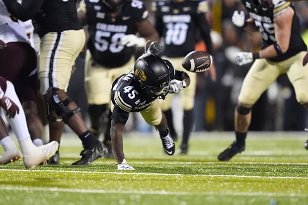 Nov 22, 2025; Boulder, Colorado, USA; Colorado Buffaloes wide receiver Ronald Coleman (45) fumbles the football in the fourth