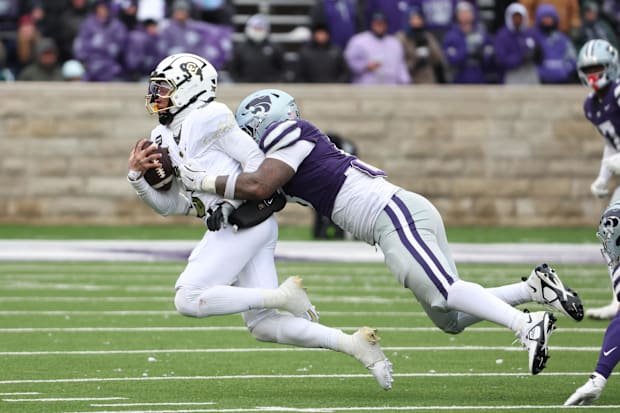 Nov 29, 2025; Manhattan, Kansas, USA; Colorado Buffaloes quarterback Kaidon Salter (3) is tackled by Kansas State Wildcats de