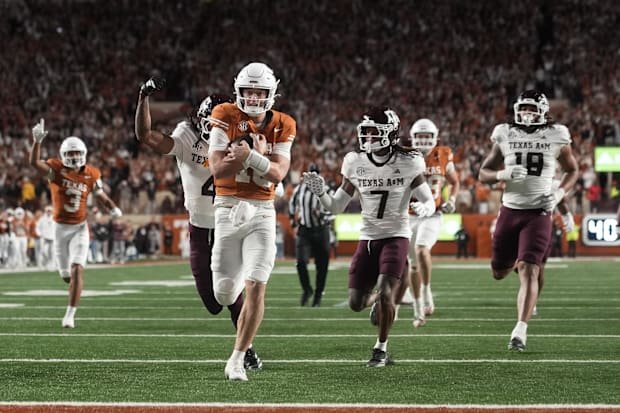 Nov 28, 2025; Austin, Texas, USA; Texas Longhorns quarterback Arch Manning keeps the ball and runs for a touchdown during the